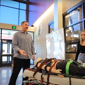 Students receive training on the use of a stretcher.